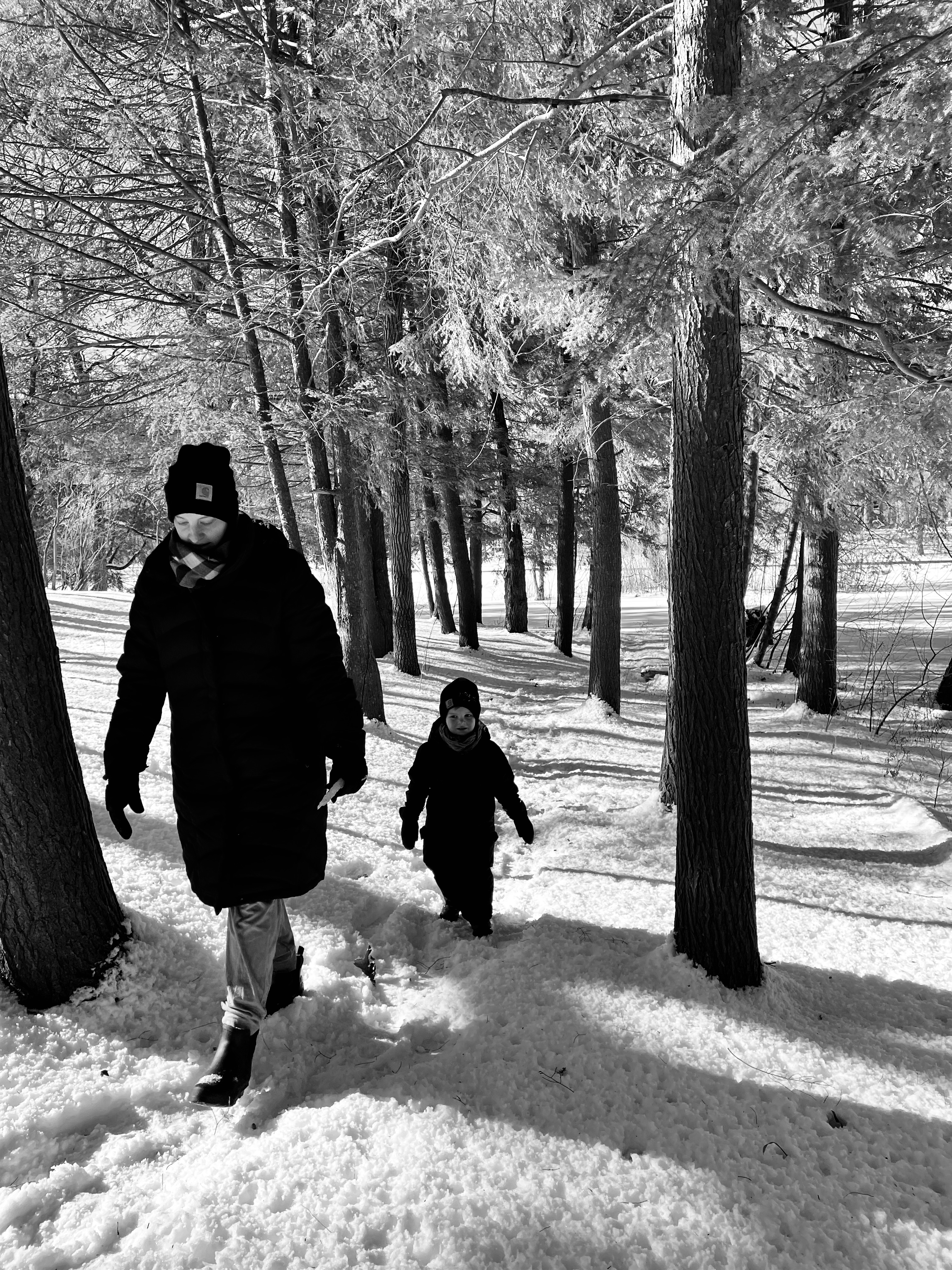 Jordan's wife, Dana, and youngest child, Leor, hiking through snow.